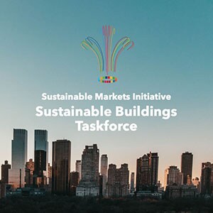 Logo of the Sustainable Buildings Taskforce overlayed on a cityscape at sunset