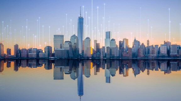 Cityscape overlaid with graphics depicting transmission nodes