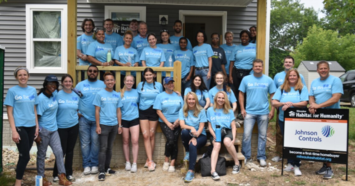 Johnson Controls volunteer group pictured in front of a future Milwaukee home they worked on