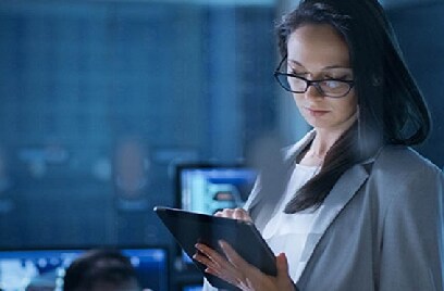 Woman working on a tablet in an office
