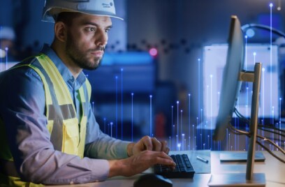 Johnson Controls technician working on a desktop, overlaid with a graphic of transmission nodes
