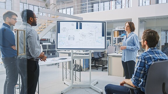 Employees in discussion at a meeting