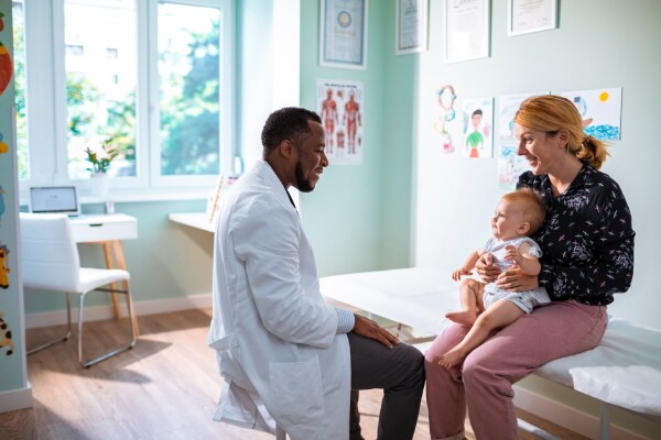 A doctor checking with patient