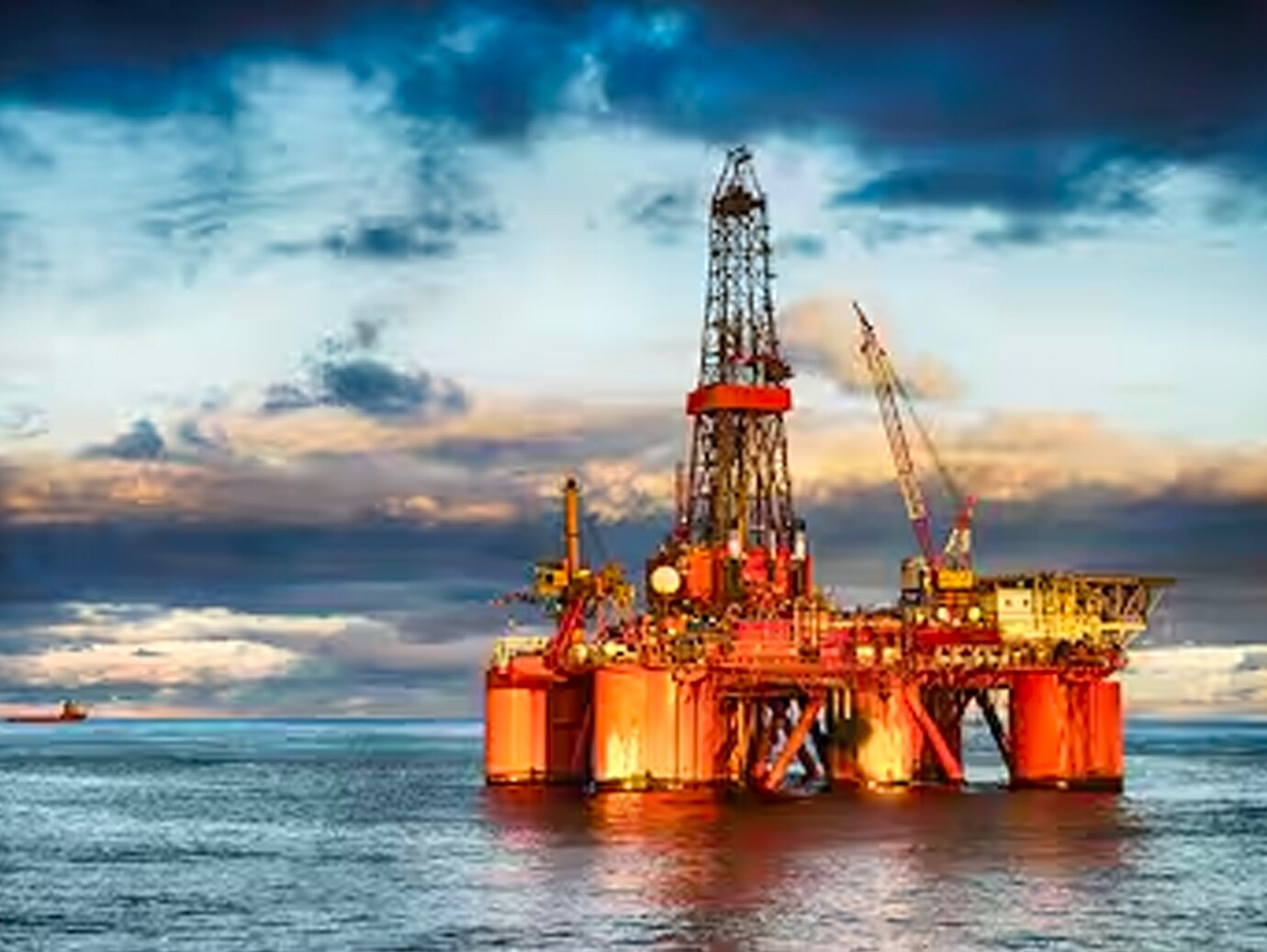 Offshore fuel processing platform in the sea at night