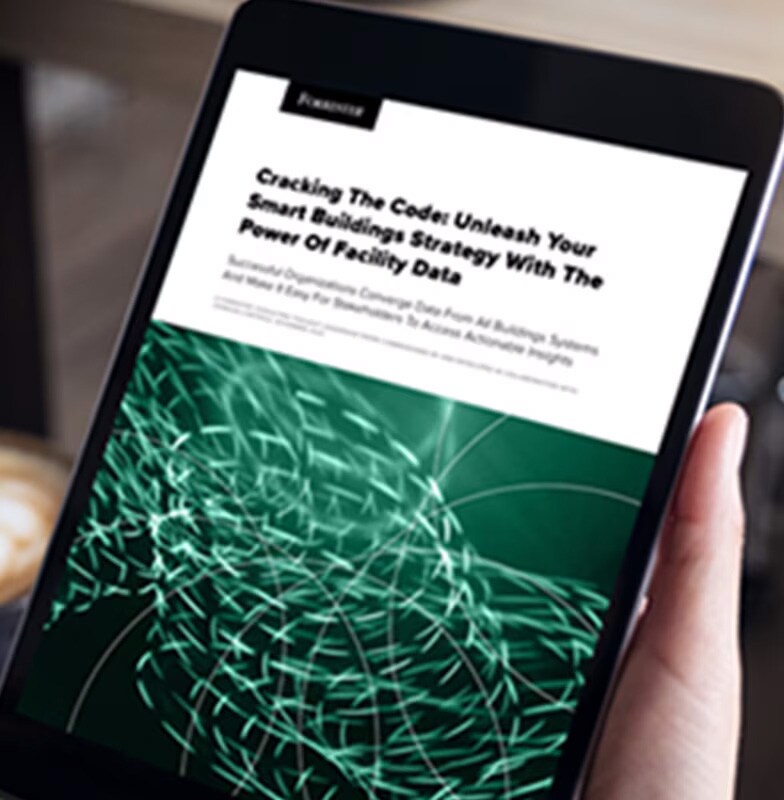 Close-up of a person holding a tablet and reading a Forrester article